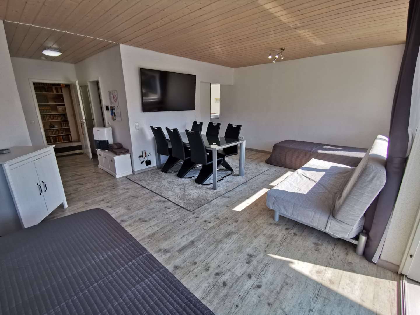 Living Room with 2 Single Beds, Couch and 65" Smart TV